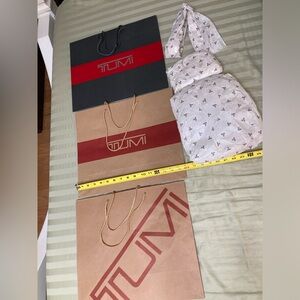 Tumi paper shopping bags lot of 3, plus paper tissues inserts